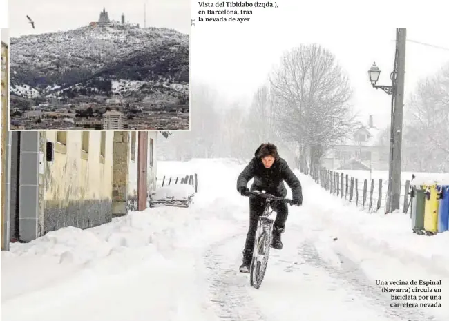  ?? EFE ?? Vista del Tibidabo (izqda.), en Barcelona, tras la nevada de ayer Una vecina de Espinal (Navarra) circula en bicicleta por una carretera nevada