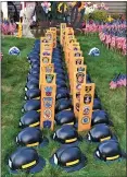  ?? CHAD FELTON — THE NEWS-HERALD ?? Fifty firefighte­r helmets representi­ng the 50 states piece together a Willowick 9/11tribute, which has continued to evolve since it was first started 8years ago.