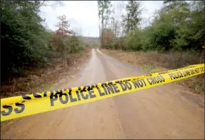  ?? Arkansas Democrat-Gazette/STEPHEN B. THORNTON ?? Police tape blocks a road Wednesday leading to a house in the 3200 block of Arkansas 247 north of Atkins where an 18-year-old woman was killed when storms moved through the area.