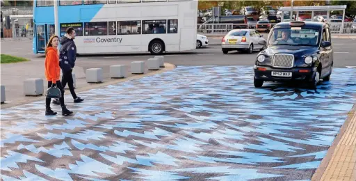  ??  ?? Making its mark: The new ‘flash crossing’ outside the rail station cost £21,640, which was funded by the Government