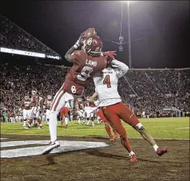  ?? IAN MAULE / TULSA WORLD ?? Oklahoma wide receiver CeeDee Lamb goes up for a pass in the Texas Tech end zone, defended by defensive back Desmon Smith during the 7-1 Sooners’ Big 12 matchup with the Red Raiders on Saturday in Norman, Okla. OU won 49-27.