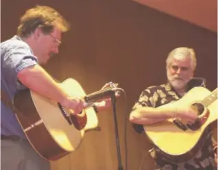  ?? STAFF FILE PHOTO ?? Three-time national flatpick guitarist Roy Curry, left, will be among the special guests as Bill McCallie, right, hosts a live taping of his weekly radio show, “Cowboy Jubilee,” 5:30-7:30 p.m. Sunday, Nov. 24, at Bill Hullander’s farm, 10944 Apison Pike in Apison. “Cowboy Jubilee,” offering Western swing, cowboy songs and poetry, airs Sundays at 6 p.m. on WSMC-FM. This live taping for later broadcast also will feature McCallie’s band, In Cahoots, with Gordy Nichol on steel guitar, Chrissie Nichol on mandolin, Jim Pankey on banjo, Meredith Goins on fiddle, Mike Harris on bass and Bernard Tate on percussion. Barry Wilde will play keyboards, and Patrick Kelley and Eli Beard will add vocals. Admission is $5. Proceeds go to the Hunter Worley Foundation, with a matching grant from Modern Woodmen of America.
Friday, Nov. 22:
Saturday, Nov. 23. each Saturday.