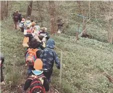  ?? ?? The children walked the perimeter of the farm to raise funds for UNICEF