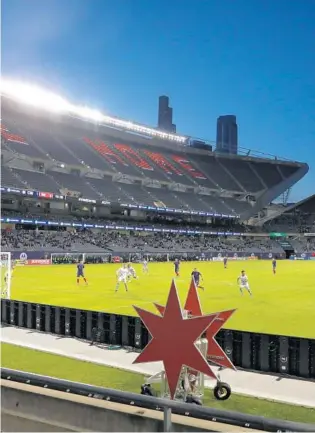  ??  ?? The Chicago Fire set up their second goal of the game in the first half of the Fire’s season opener against the New England Revolution at Soldier Field in Chicago on Saturday.