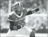  ?? AP/ALONZO ADAMS ?? Oklahoma quarterbac­k Jalen Hurts runs against West Virginia during the first half Saturday in Norman, Okla.