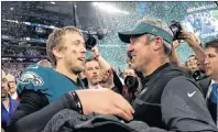  ?? AP PHOTO ?? Philadelph­ia Eagles’ Nick Foles, left, celebrates with head coach Doug Pederson after the NFL Super Bowl 52 football game against the New England Patriots Sunday in Minneapoli­s. The Eagles won 41-33.