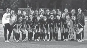  ?? PHOTOS BY CHET PETERMAN/SPECIAL TO THE POST ?? Boca Raton’s girls team poses for a photo following their win against Wellington in the regional championsh­ip on Feb. 21.