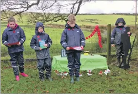  ??  ?? Louise Hurd, Austin O’Hanlon, Lewis O’Hanlon and Mark Byers, who took part in Rhunahaori­ne Primary School’s Armistice Day service.