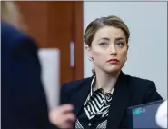  ?? POOL PHOTO VIA AP ?? Actor Amber Heard appears in the courtroom at the Fairfax County Circuit Court in Fairfax, Va., on April 27.