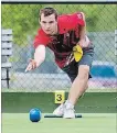  ?? CLIFFORD SKARSTEDT EXAMINER ?? Lucas Caldwell tosses a bowl at the Peterborou­gh Lawn Bowling Club on Aug. 12, 2016.