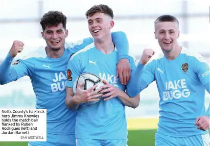  ?? DAN WESTWELL ?? Notts County’s hat-trick hero Jimmy Knowles holds the match ball flanked by Ruben Rodrigues (left) and Jordan Barnett