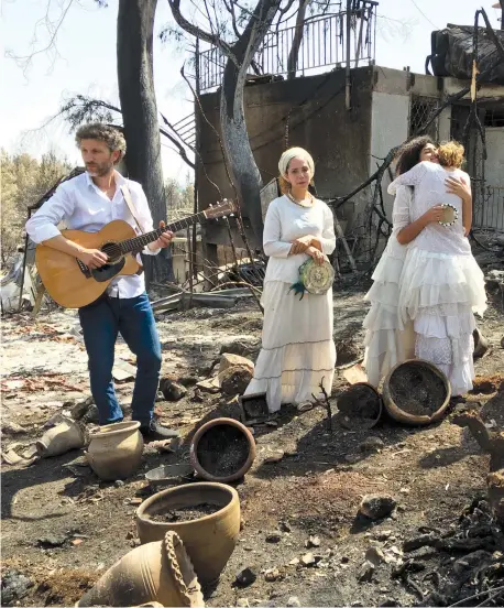  ??  ?? MERAV OF Mevo Modi’im municipal council asked Leah Sand and other young ladies dressed in white to sing one of the beloved songs of Shlomo Carlebach – ‘dressing people in the village in a garment of splendor instead of a drooping spirit.’