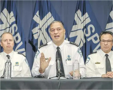  ?? JOHN MAHONEY / MONTREAL GAZETTE ?? Many media organizati­ons have denounced the police operation, and some opposition city councillor­s are calling for police Chief Philippe Pichet, centre, to step down.