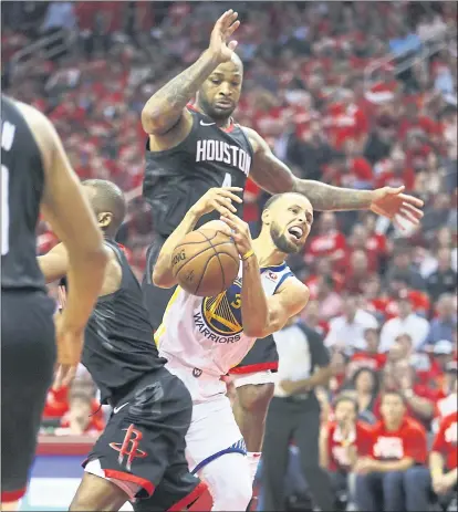  ?? PHOTOS BY NHAT V. MEYER — STAFF PHOTOGRAPH­ER ?? The Warriors’ Stephen Curry loses the ball against the defense of the Rockets’ PJ Tucker in the second quarter Thursday.