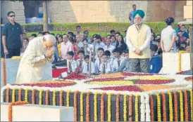  ?? AJAY AGGARWAL/HT PHOTO ?? ■ Prime Minister Narendra Modi pays tributes to Mahatma Gandhi on his 150th birth anniversar­y at Gandhi Memorial, Rajghat, in New Delhi on Wednesday.