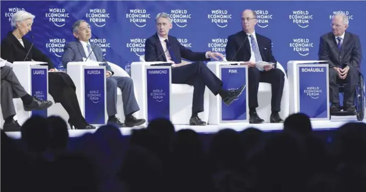  ??  ?? DAVOS: (From left), Franceís Christine Lagarde, Managing Director of the Internatio­nal Monetary Fund, IMF, Bank of Japan Governor Haruhiko Kuroda, British Treasury Chief Philip Hammond, Laurence D Fink, Chairman and CEO of BlackRock Inc and German...