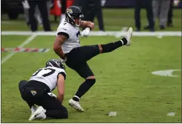  ?? TODD OLSZEWSKI — GETTY IMAGES ?? Jacksonvil­le Jaguars placekicke­r and Orland High grad Aldrick Rosas (7) kicks an extra point during the third quarter Sunday against the Baltimore Ravens in Baltimore.