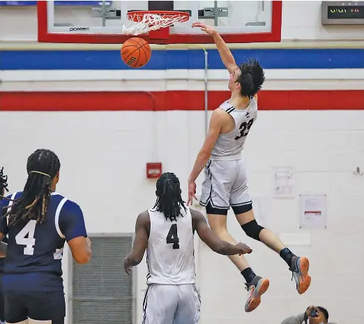  ?? ALLEN CUNNINGHAM/SUN-TIMES ?? Mount Carmel 6-6 junior Angelo Ciaravino (33) had 24 points and 11 rebounds Wednesday in the Caravan’s victory against Hyde Park.