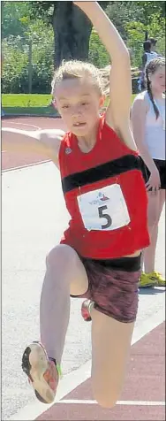  ??  ?? Emma Ryan leaps to victory in the long jump