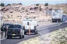  ?? ROBERTO E. ROSALES/JOURNAL ?? The bodies of a man and woman were found in this pickup truck with a camper shell on the shoulder of eastbound I-40 on Thursday morning.