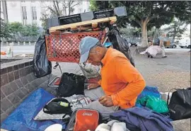  ??  ?? A NONPROFIT analyzed data to factor in people who may become homeless more than once a year. Above, Alvaron Morrow rests outside a museum in July.