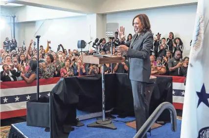  ?? RYAN GARZA/DFP ?? Vice President Kamala Harris waves to the crowd after speaking during a vaccine mobilizati­on event at the TCF Center in downtown Detroit on Monday. “Getting vaccinated is the single best defense against COVID-19 and its variants,” she said.
