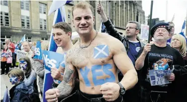  ?? ANDY BUCHANAN/AFP/GET TY IMAGES/FILE ?? Pro-independen­ce supporters attend a rally in Edinburgh, Scotland. The Scottish Parliament has a five-year plan to promote the declining Scottish Gaelic language, mainly using online strategies.