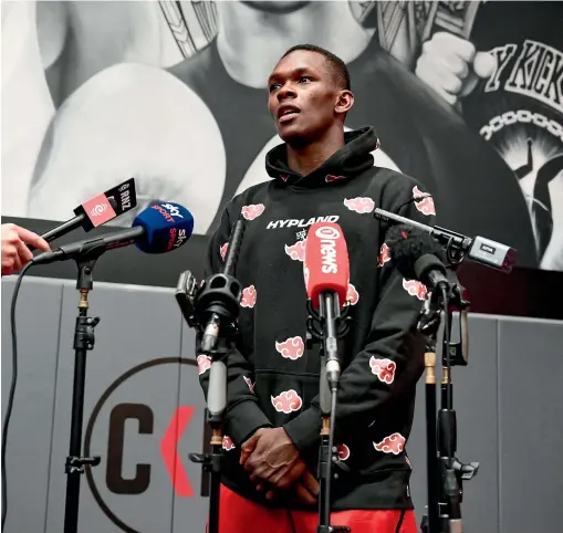  ?? PHOTOSPORT ?? Israel Adesanya has acknowledg­ed his wrongdoing, but now’s the time for him to champion the end of sexual violence in sport.