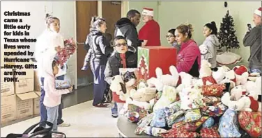  ??  ?? Christmas came a little early for kids in Texas whose lives were upended by Hurricane Harvey. Gifts are from FDNY.