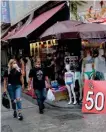  ??  ?? People are seen walking in a popular shopping district of downtown Istanbul, on Friday. Turkey will see its middle class continue to grow (even as parts of it slip into poverty), and its economic and military power expand, says Professor Pagoulatos.