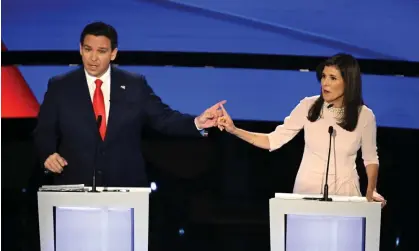  ?? ?? Ron DeSantis and Nikki Haley spar during the debate in Iowa on Wednesday night. Photograph: AFP/Getty Images