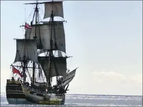  ?? AP PHOTO/RONEN ZILBERMAN ?? In this Nov. 15, 1999, file photo, people watch as a replica of the HMB Endeavour leaves Honolulu, as it embarked on a fouryear, around-the-world cruise.