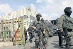  ?? REUTERS ?? Israeli soldiers patrol near the scene of a shooting in which a Palestinia­n killed two Israelis and injured another.