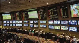  ?? BRIDGET BENNETT/NEW YORK TIMES 2017 ?? People bet on sports last August in Las Vegas. Monmouth Park, a New Jersey horse track, said it would start taking sports bets Thursday.