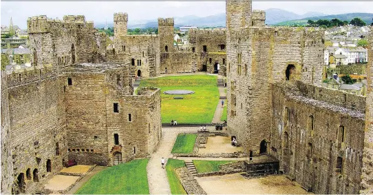  ?? GRETCHEN STRAUCH ?? A huge green courtyard is one of the highlights of the most famous Welsh fortress, Caernarfon Castle, where the last two princes of Wales were invested.