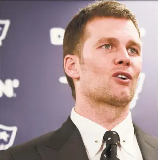  ?? Don Wright / Associated Press ?? Patriots quarterbac­k Tom Brady talks to reporters after Sunday’s loss to the Steelers in Pittsburgh.