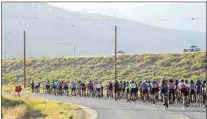  ?? NICK SMIRNOFF / FOR TEHACHAPI NEWS ?? Riders stretch out along Tehachapi Boulevard on the way to Sand Canyon during the GranFondo in 2019.