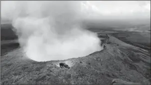  ?? The Associated Press ?? ERUPTION: In this photo provided by U.S. Rep. Tulsi Gabbard, who is on active duty Hawaii National Guard deployment, ash from the Puu Oo vent on Kilauea volcano rises into the air Saturday near Pahoa, Hawaii. Hawaii’s erupting Kilauea volcano has...