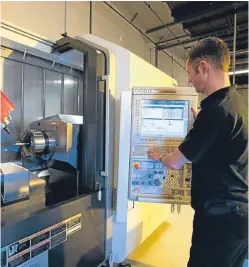  ??  ?? A technician operating a CNC machine at Pryme Group’s workshop at West Pitkerro Industrial Estate.