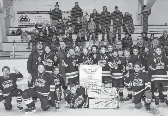  ?? SUBMITTED ?? The Trenton peewee C Steelers went undefeated to nab gold at the Middleton Mustangs tournament last weekend. Members of the championsh­ip team, with their fans in the background, are, front row, from left, Ross Swinamer, Lane MacFarlane, Ethan Francis, Derrick MacKay, Seth Francis and Aiden Trowell. Second row, coach Danial Dickson, Tyson Barteaux, coach Mike MacDonald, Landon Martin, Jesse Arbuckle, Ethan MacKay, Jake Maloney, Brett Butler, Thai MacDonald, Cole MacGregor, Caden MacDonald, Carter Lennon, coach Ricky Swinamer and coach Freddy MacKay. Missing is coach Glen Butler.