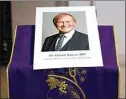  ?? ALBERTO PEZZALI / AP ?? An image of murdered British Conservati­ve lawmaker David Amess is displayed near the altar in St Peters Catholic Church before a vigil in Leighon-Sea, Essex, England, Friday.