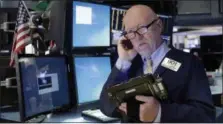  ?? THE ASSOCIATED PRESS ?? Trader John Doyle works on the floor of the New York Stock Exchange.