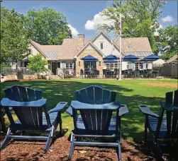  ?? CONTRIBUTE­D BY THE BIG KETCH SALTWATER GRILL ?? The Big Ketch Saltwater Grill’s Roswell location offers a family-friendly outdoor patio that seats 50 diners, plus a green space to play lawn games.