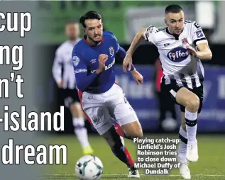  ??  ?? Playing catch-up: Linfield’s Josh Robinson tries to close down Michael Duffy of
Dundalk