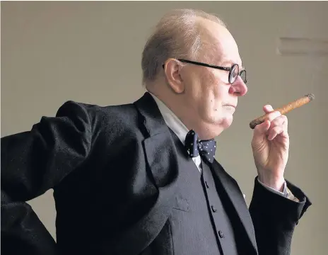  ?? JACK ENGLISH ?? Gary Oldman as Winston Churchill in a scene from Darkest Hour. Below, Daniel Day-Lewis in the Phantom Thread