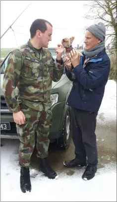  ??  ?? Andrew Kehoe of Ballindagg­in being collected by his nephew Private Richard Walsh, a member of the Defence Forces, to be transporte­d to the Wellstone Renal Centre in Drinagh, Wexford. Also pictured is Holly, the family Yorkshire Terrier.