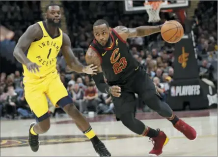  ?? TONY DEJAK — THE ASSOCIATED PRESS FILE ?? In this file photo, Cleveland Cavaliers’ LeBron James (23) drives against Indiana Pacers’ Lance Stephenson (1) in the first half of Game 7 of an NBA basketball first-round playoff series, Sunday in Cleveland.