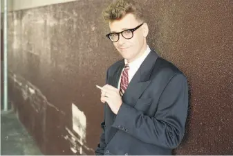  ?? Frederic Larson / The Chronicle 1992 ?? Greg Proops gets ready for a headlining gig at San Francisco’s Punch Line in September 1992.