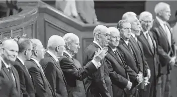  ?? Rick Bowmer / Associated Press ?? The Church of Jesus Christ of Latter-day Saints President Russell M. Nelson, center, greets the semiannual general conference of The Church of Jesus Christ of Latter-day Saints in Salt Lake City on Saturday.