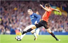  ??  ?? Everton's English striker Wayne Rooney (L) vies with MFK Ruzomberok's Matej Kochan during the UEFA Europa League third qualifying round, Game 1 match between Everton and Ruzomberok at Goodison Park football stadium in Liverpool on July 27, 2017.